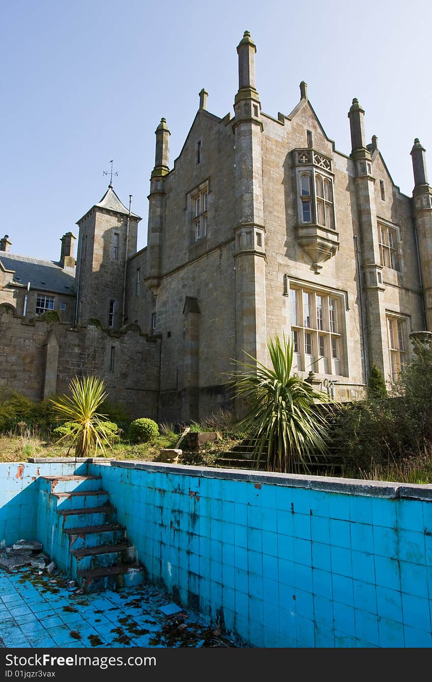 Mansion with a derelict out door pool. Mansion with a derelict out door pool