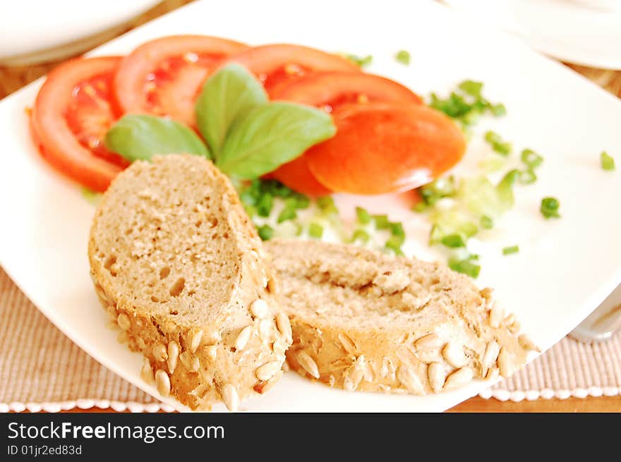 Sandwiches with tomatoes, chive and basil leaves. Sandwiches with tomatoes, chive and basil leaves