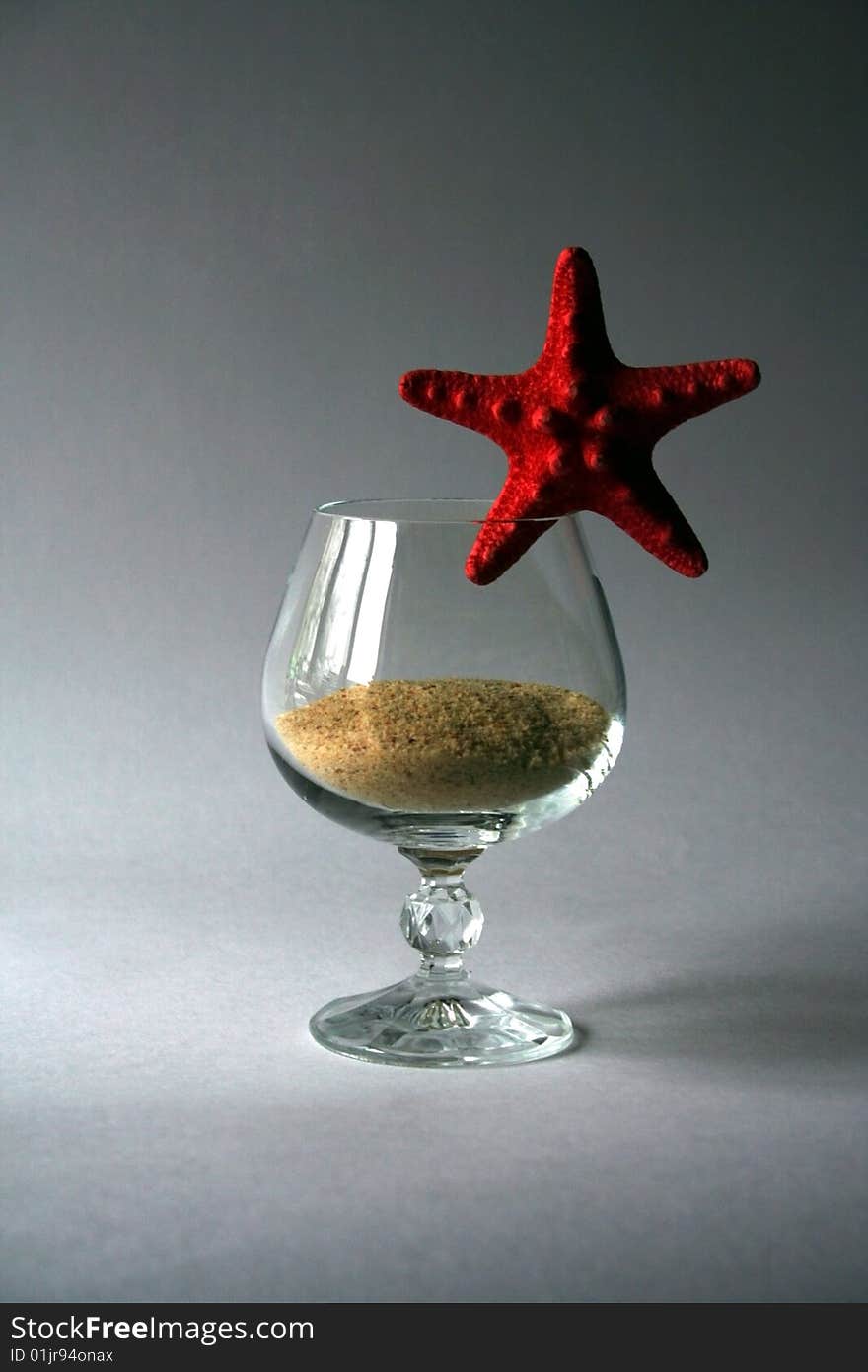 Sand in goblet with starfish. Sand in goblet with starfish.