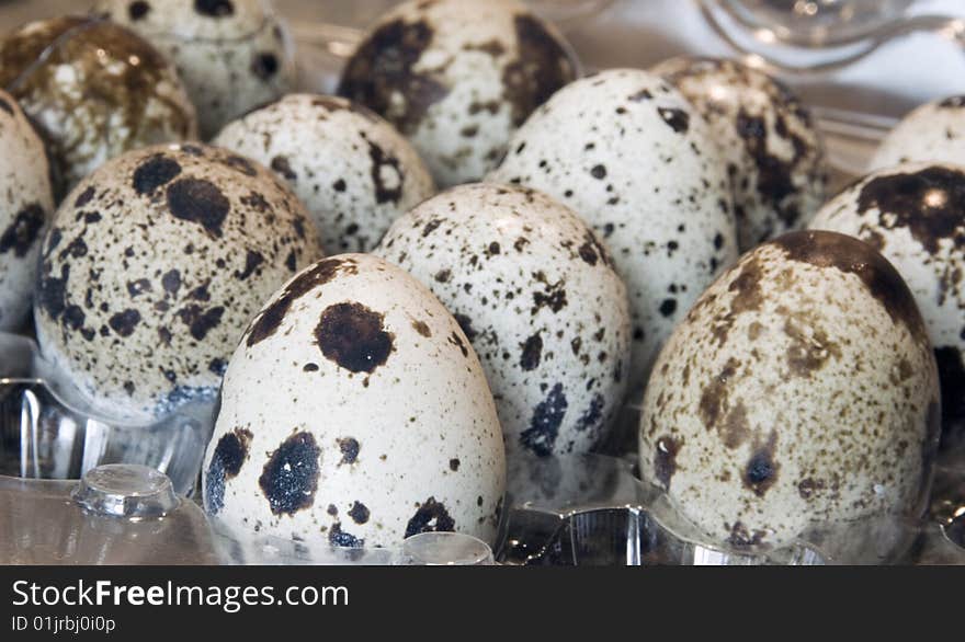 Blotched quail egg built neatly in tray. Blotched quail egg built neatly in tray