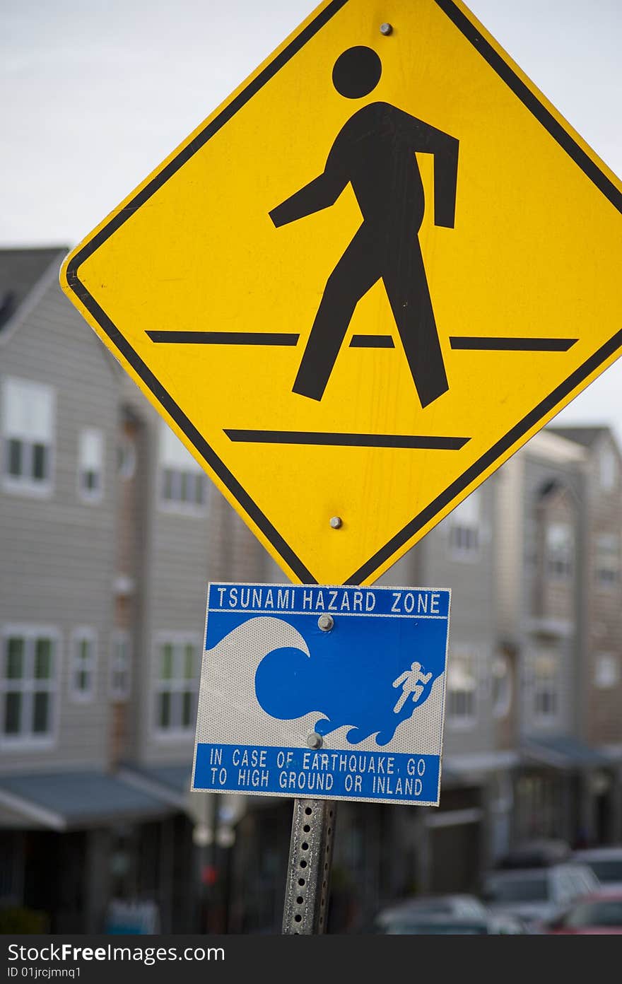 Sign posted in a town, warning of tsunamis. Sign posted in a town, warning of tsunamis.