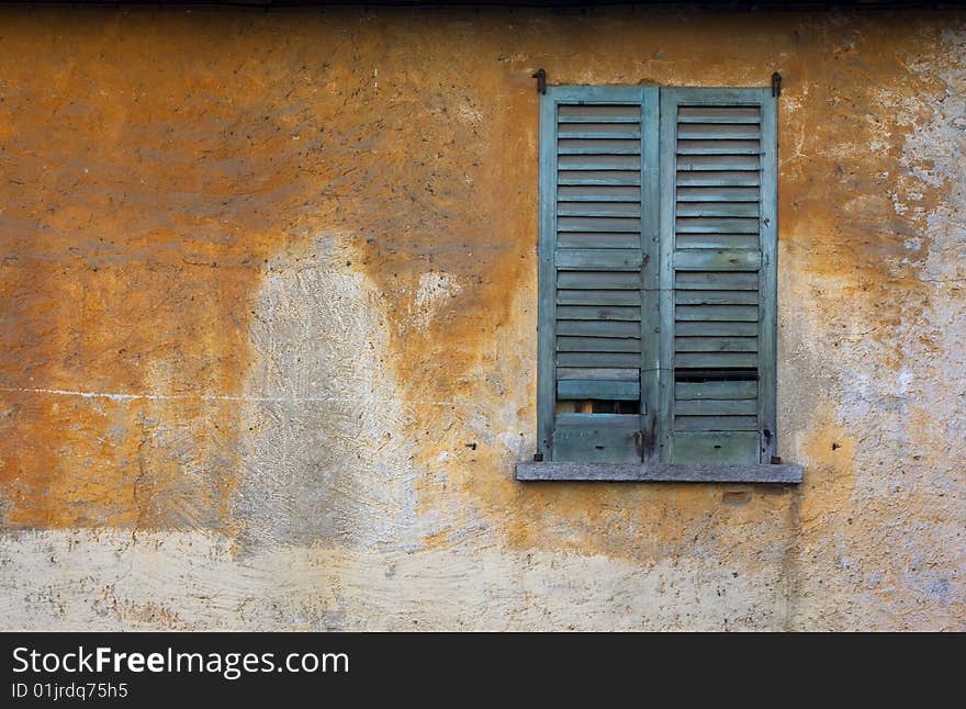 Old dilapidated building in the window