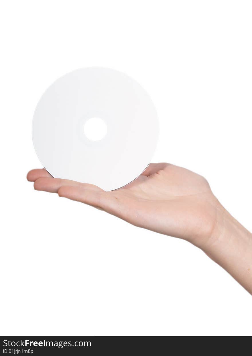 The female hand holds  a disk on a white background. The female hand holds  a disk on a white background