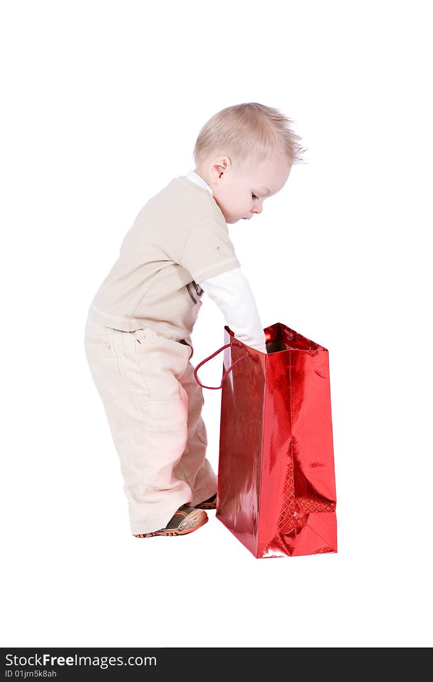 Happy kid with his present over a white background