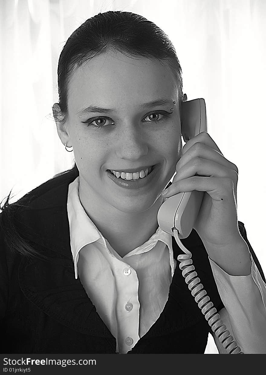 Attractive young woman calling by phone. Attractive young woman calling by phone