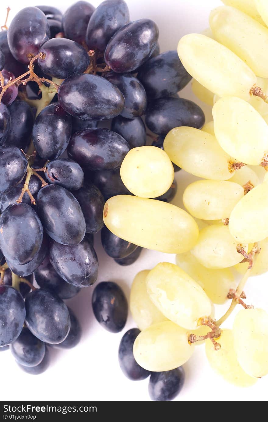 Black and green ripe grape isolated on white