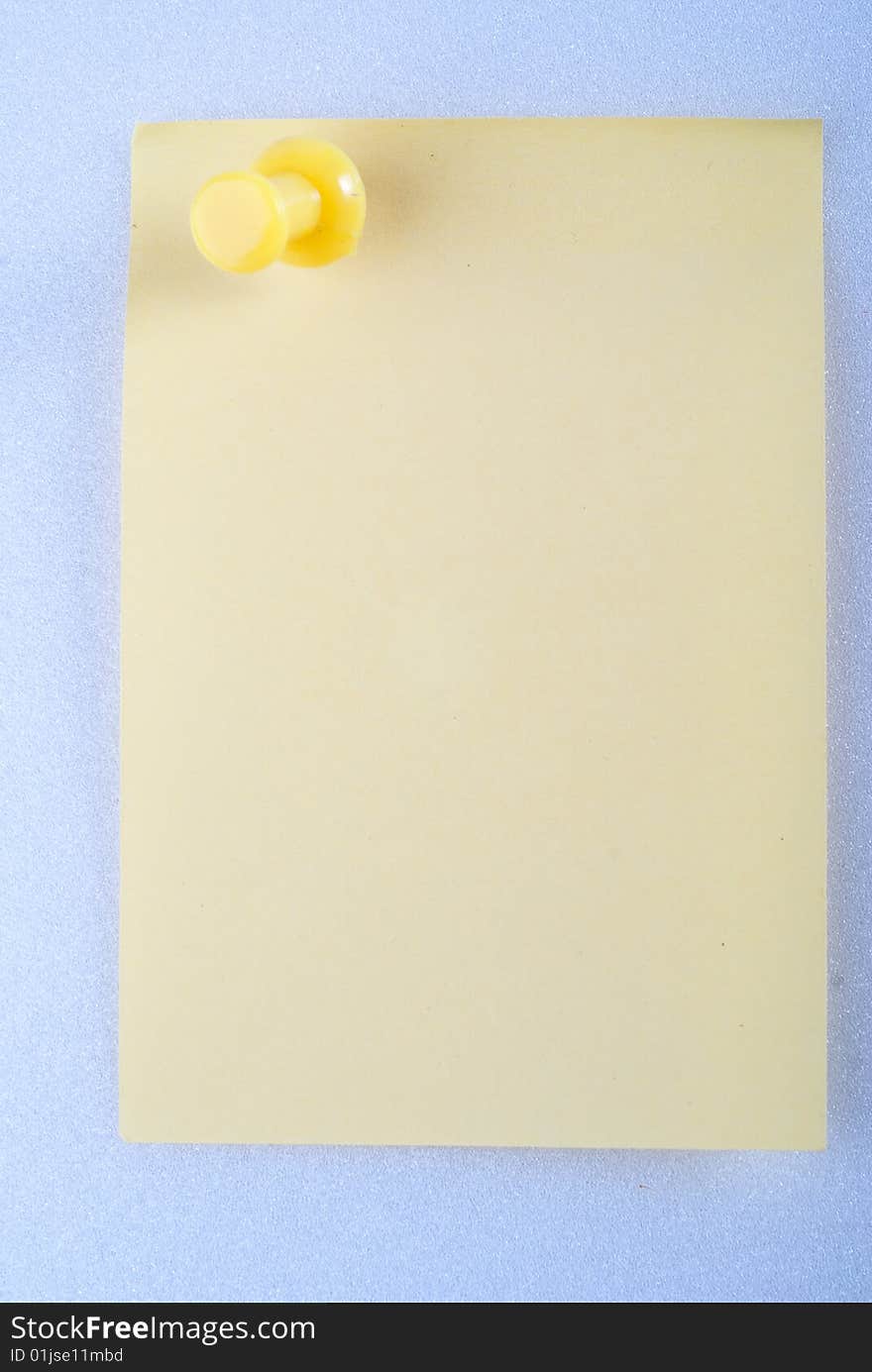 Yellow post it note with color pin isolated. Yellow post it note with color pin isolated