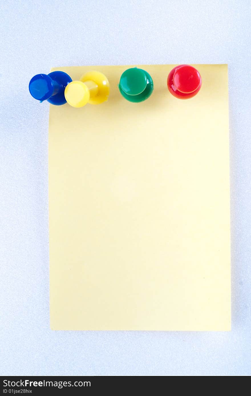 Yellow post it note with color pin isolated. Yellow post it note with color pin isolated