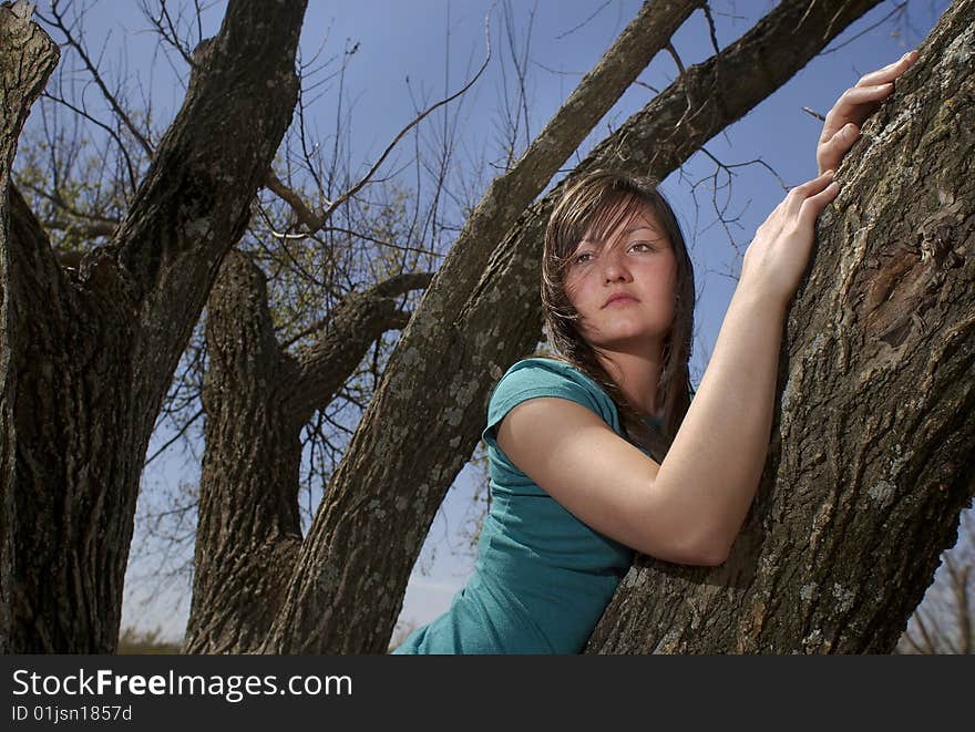 Teen girl in tree