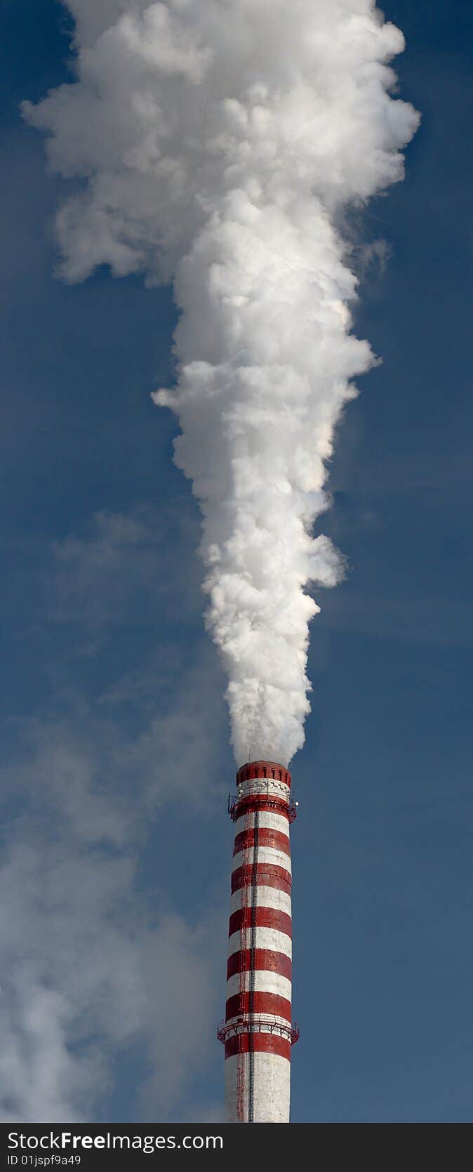 Smoking gas power plant stack closeup, vertical panorama. Smoking gas power plant stack closeup, vertical panorama