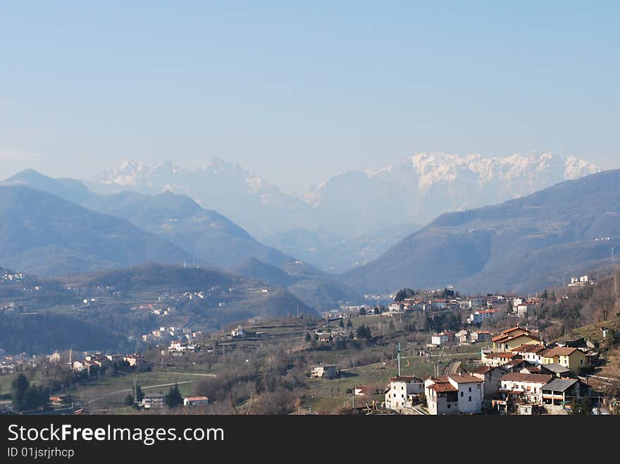 Landscape. The occupied valley in easy a smoke, on a background of mountains and rocks covered by a snow. Landscape. The occupied valley in easy a smoke, on a background of mountains and rocks covered by a snow.