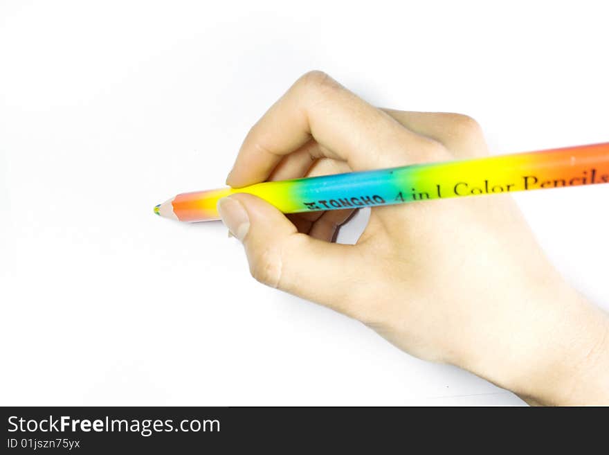 Close-up shot of a girl's hand, holding a pencil. Close-up shot of a girl's hand, holding a pencil