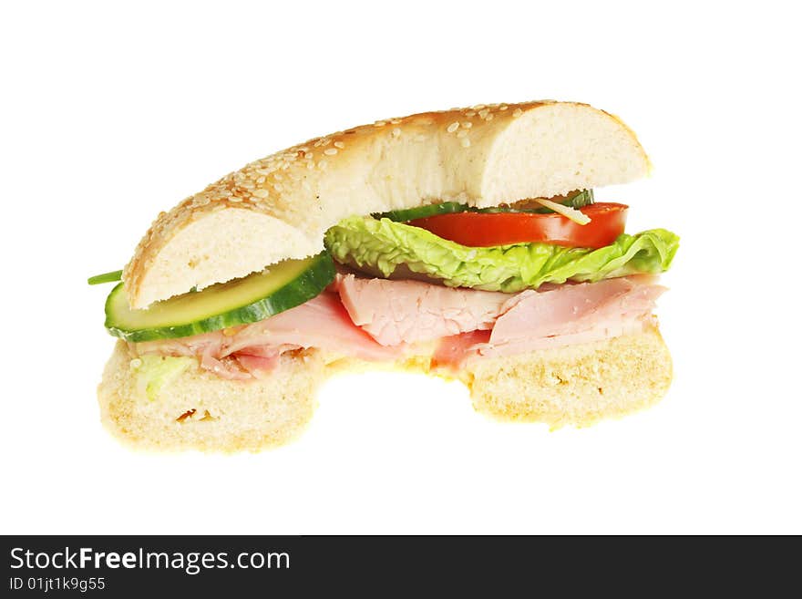 Half a bagel roll filled with ham and salad. Half a bagel roll filled with ham and salad