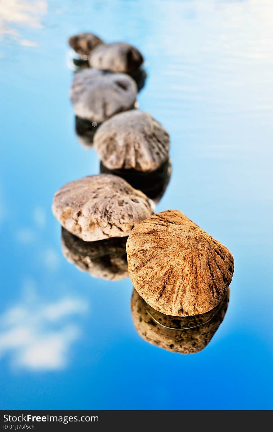 Reflexion of sea stones and the sky. Reflexion of sea stones and the sky