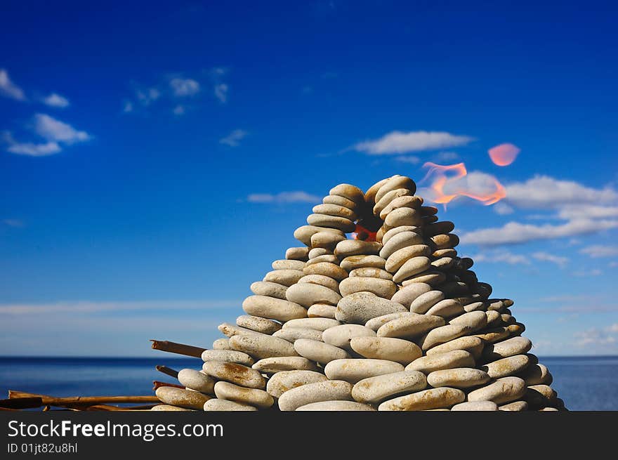 Pyramid from a pebble with internal fire. Pyramid from a pebble with internal fire