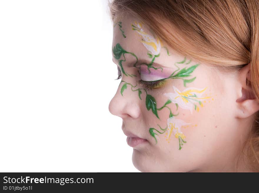 Beautiful blondy with a flower tattoo on her fac