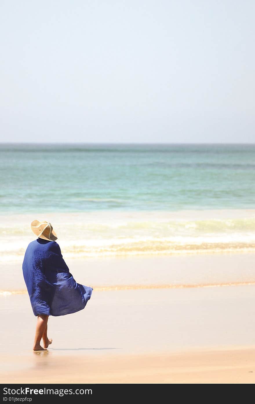 Blue Draped Woman At The Beach