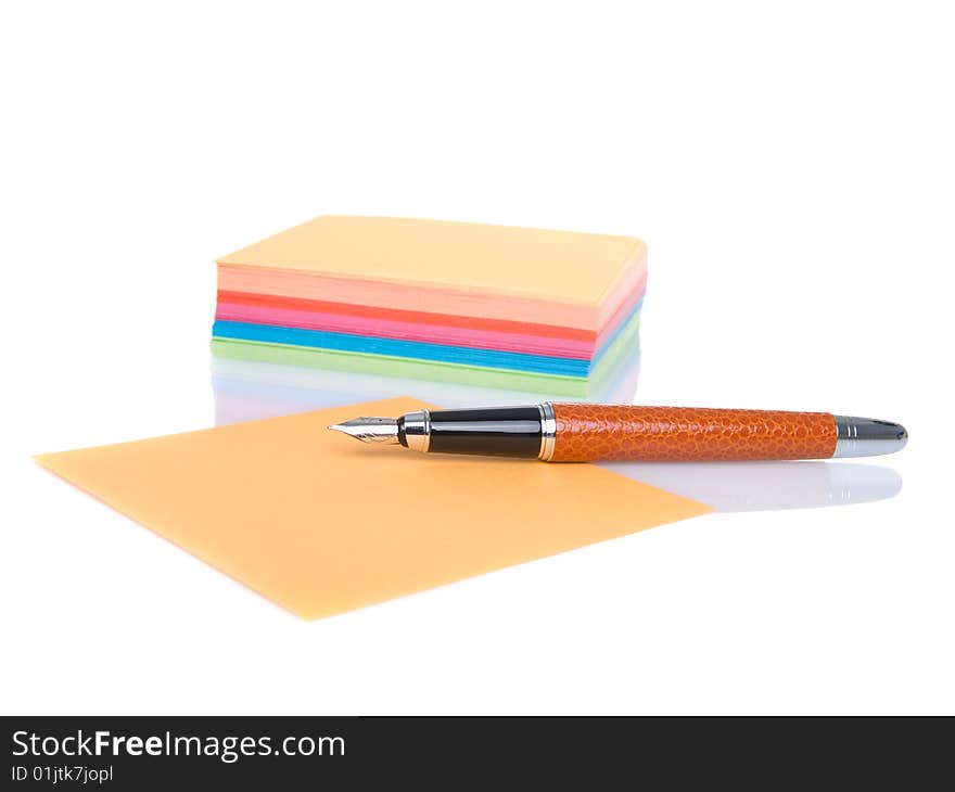 Notes block and pen isolated on a white background.