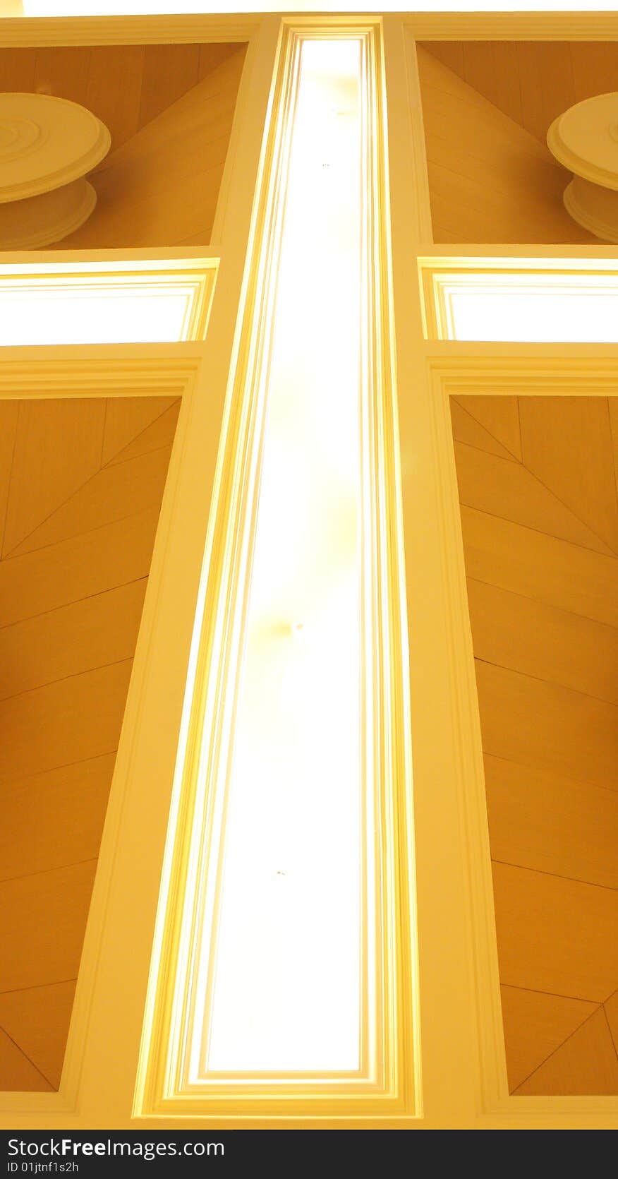 An ornament at the roof of a building mix with lamp for the florescence effect. An ornament at the roof of a building mix with lamp for the florescence effect