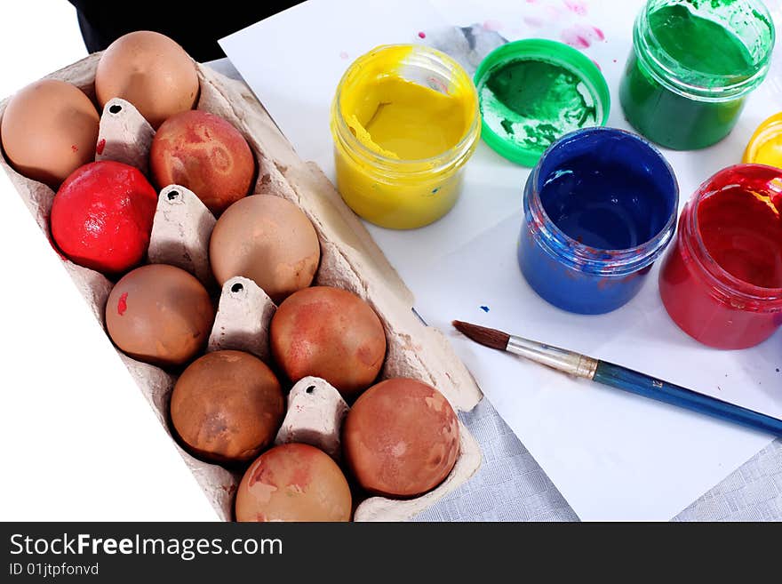 Preparing painting easter egg with brush