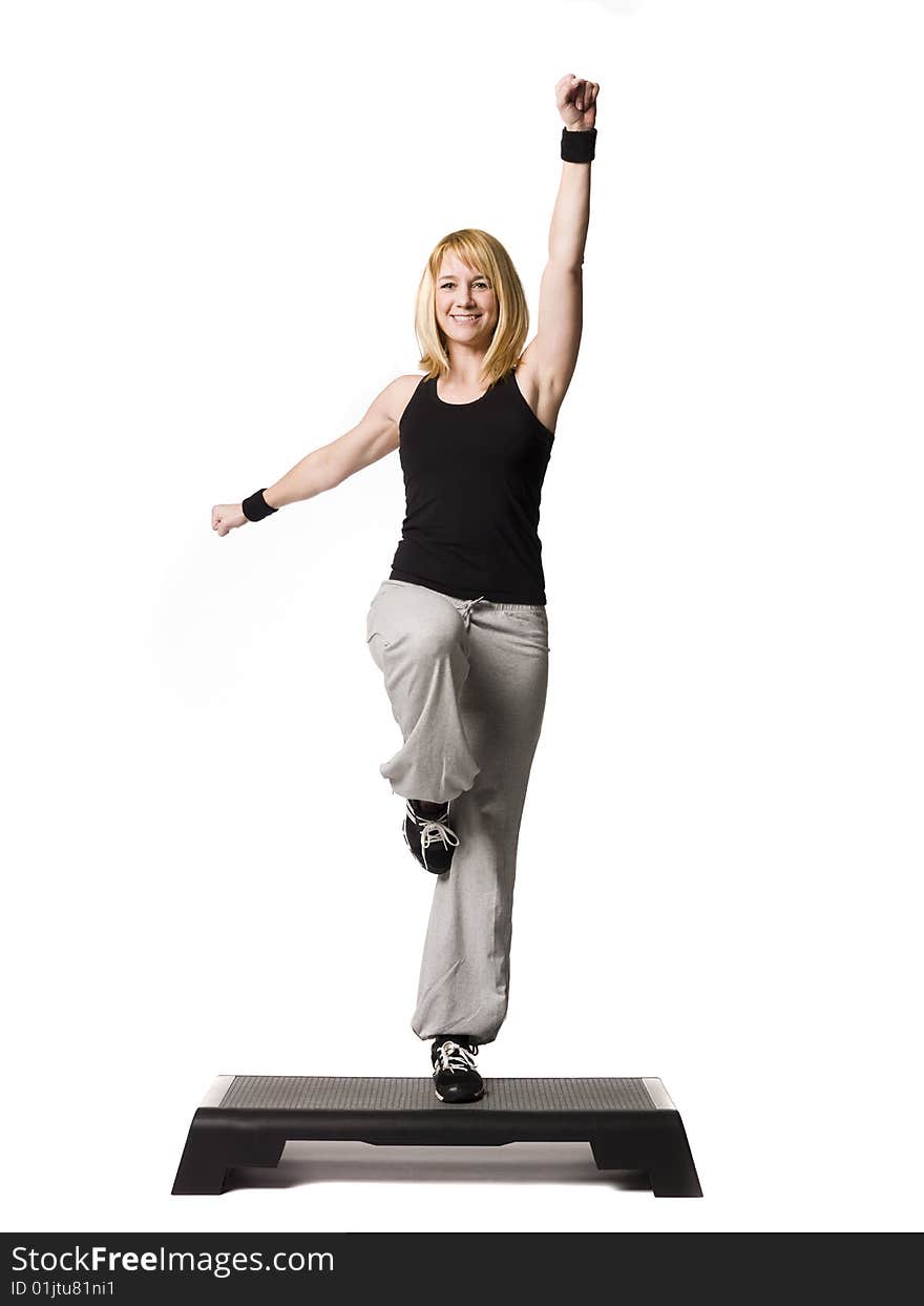 Girl working out towards white background