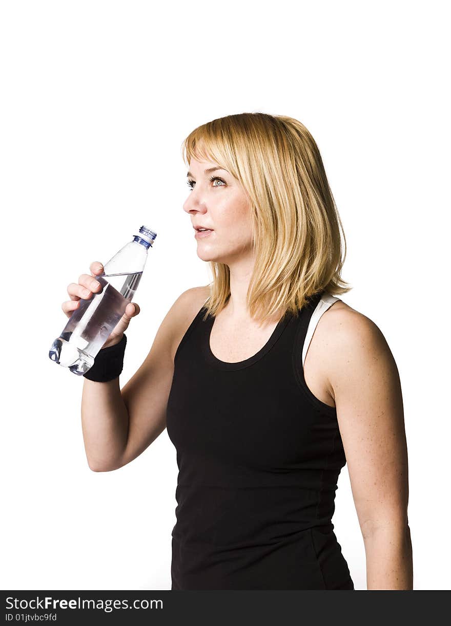 Girl drinking water towards white background