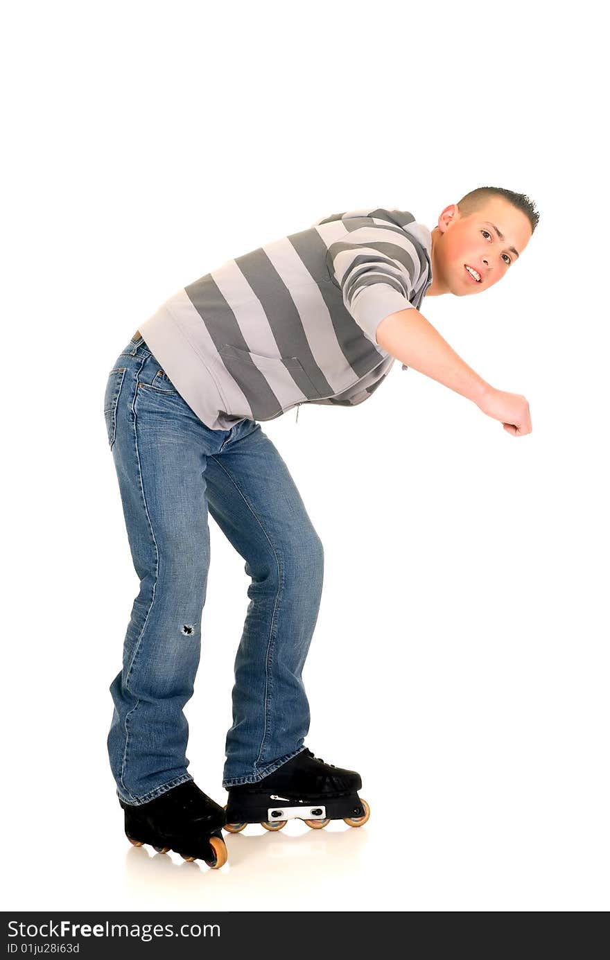 Handsome happy smiling blushing skaterboy dressed in jeans, studio shot. Handsome happy smiling blushing skaterboy dressed in jeans, studio shot