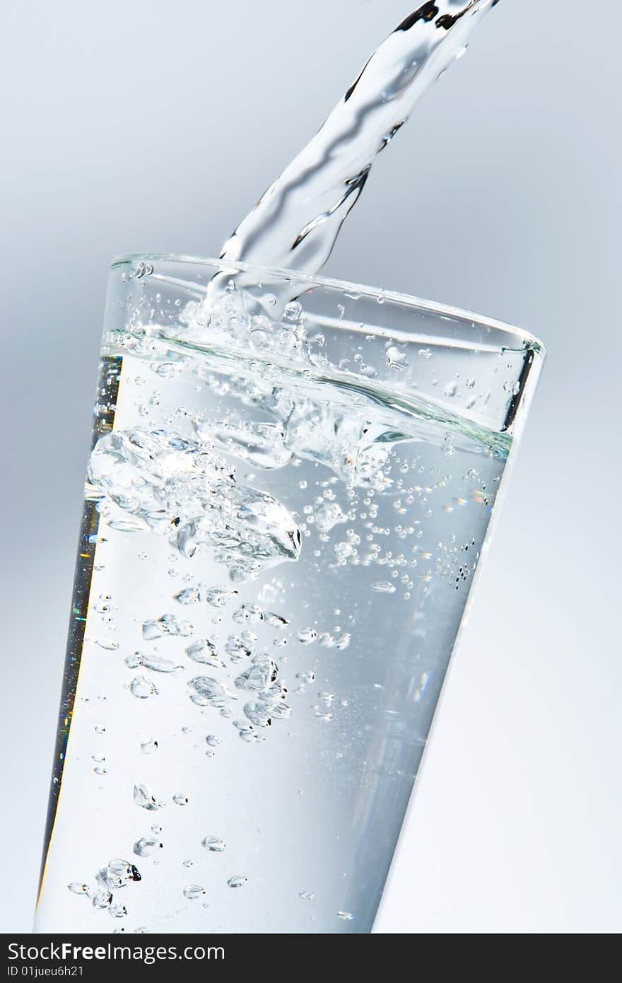 Water being poured into a glass. Water being poured into a glass