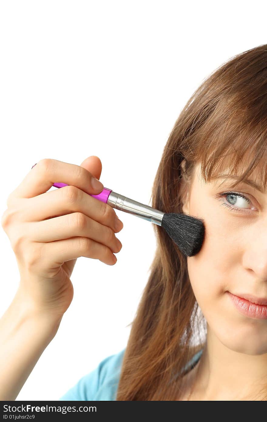 Young woman with make-up brush