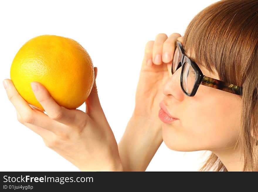 Young woman in big glasses looking to orange