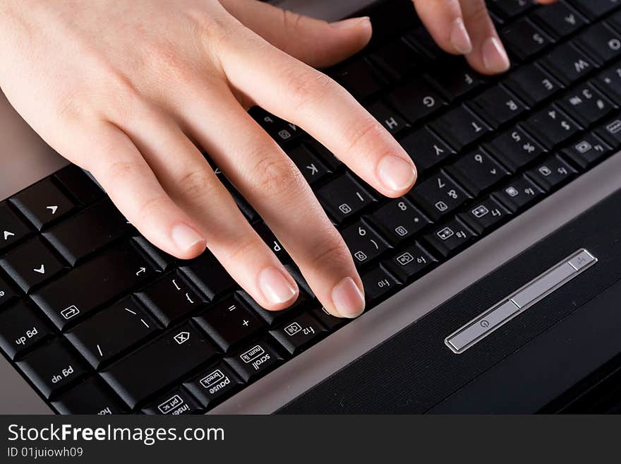 Image woman�s hands working on the laptop