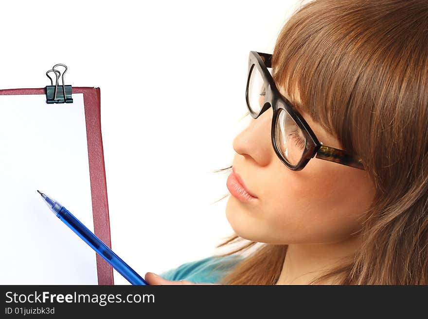 Young woman in glasses showing to blank paper field