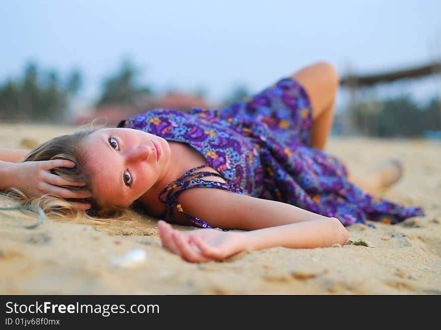 Attractive girl laying on beach