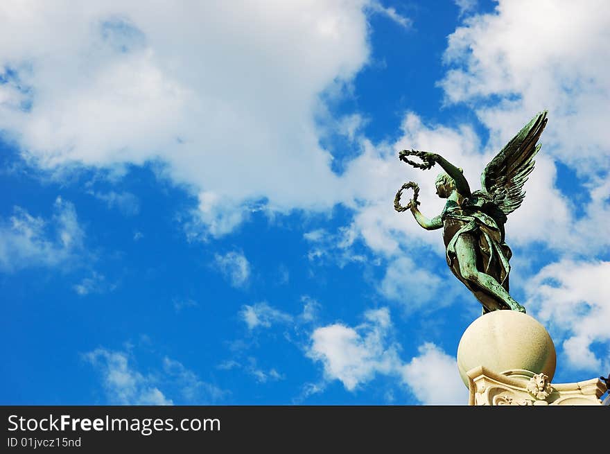 Statue on the top of a pillar near the Museum of Fine Arts, Vienna, Austria