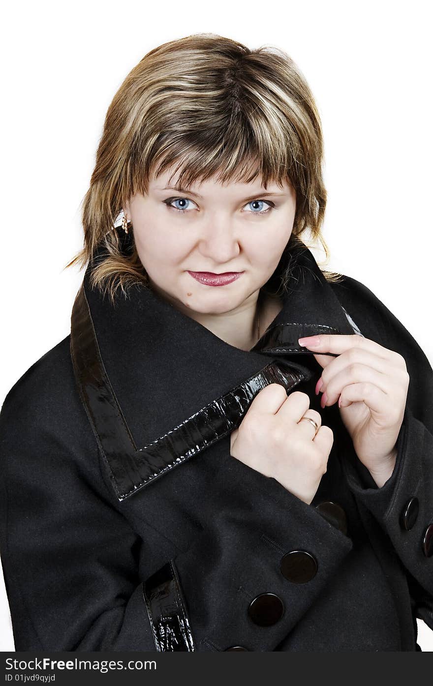 Attractive young woman in the black coat