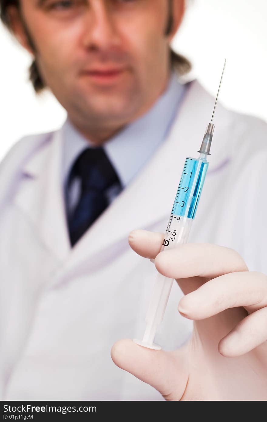 Male medic holding syringe. Isolated