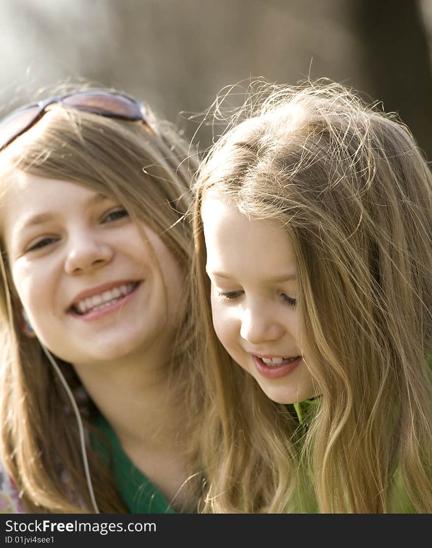 Two happy grils having fun and smiling