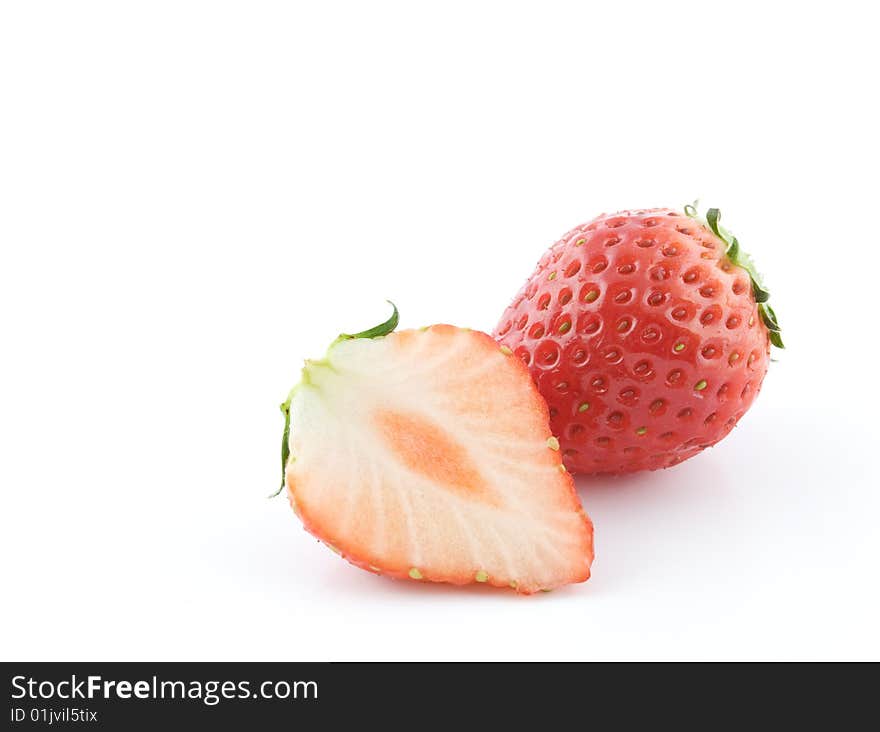 Cut strawberries on white background