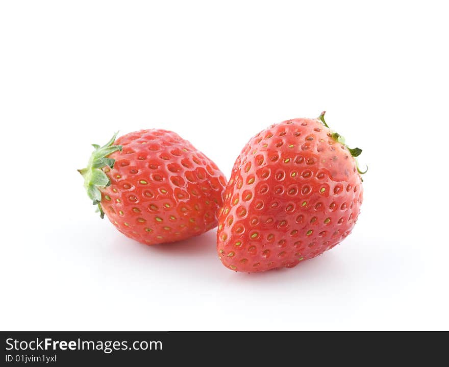 Two strawberries on white background