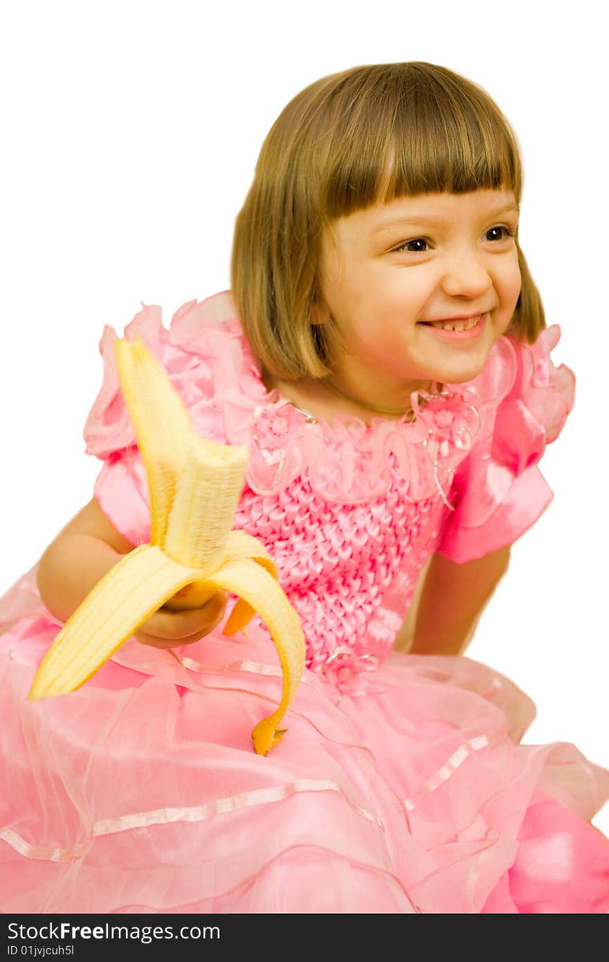 Young girl in pink dress with banana. Young girl in pink dress with banana