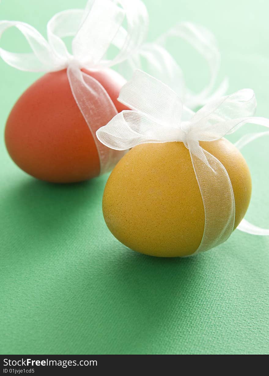 Colorful easter eggs with transparent white ribbon. Colorful easter eggs with transparent white ribbon