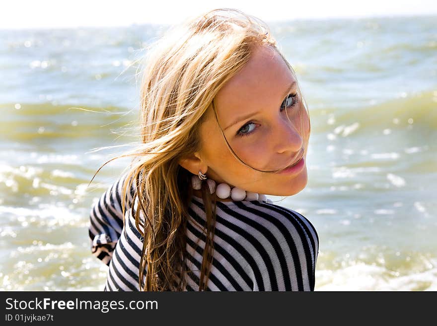 A young girl on the seashore, summer. A young girl on the seashore, summer