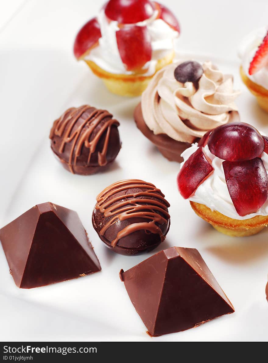 Dessert - Chocolate and Cream Candy with Fruit and Berries Slice. Dessert - Chocolate and Cream Candy with Fruit and Berries Slice