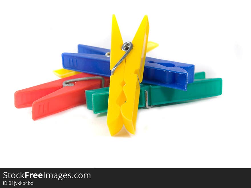 Coloured clothespins on a white background