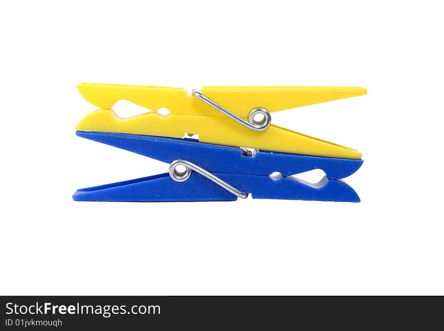 Coloured clothespins on a white background