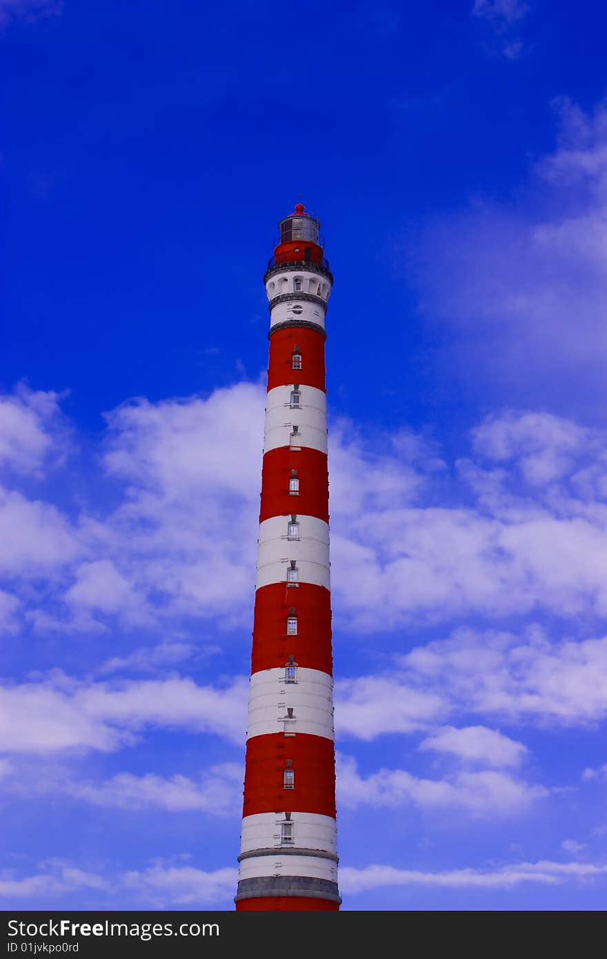 Sea beacon on blue sky. Sea beacon on blue sky