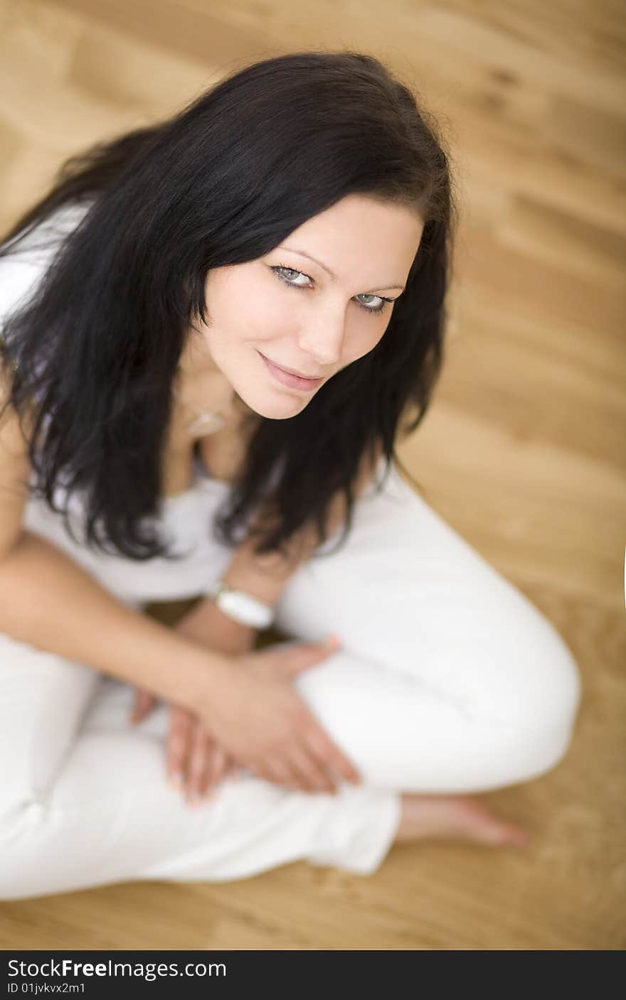 Young lady indoor sitting on floor in her new apartement. Young lady indoor sitting on floor in her new apartement