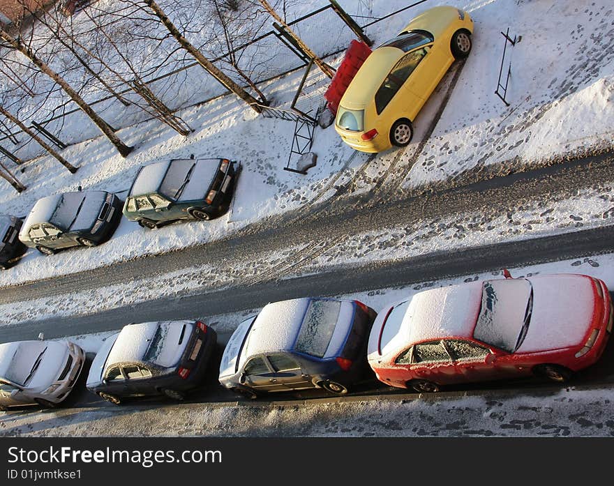 Cars in a court yard. The top view