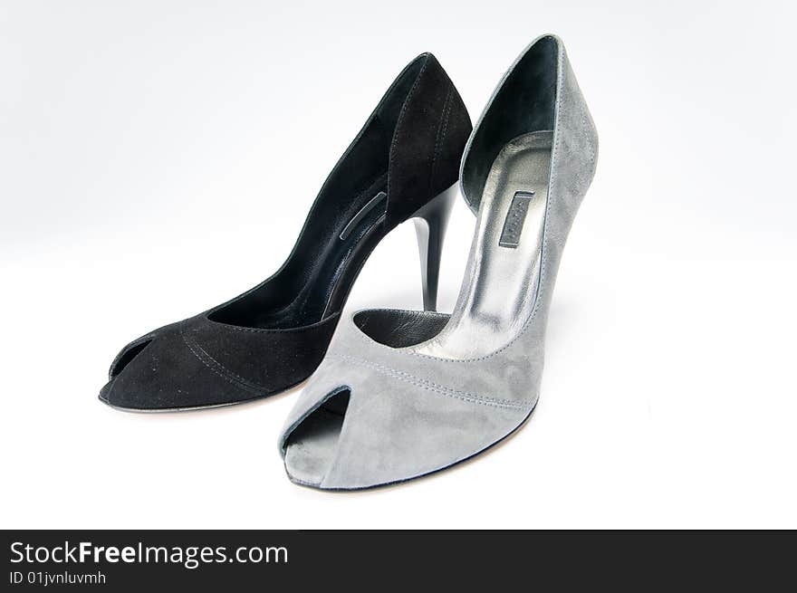 Black and gray female shoes, isolated on white background