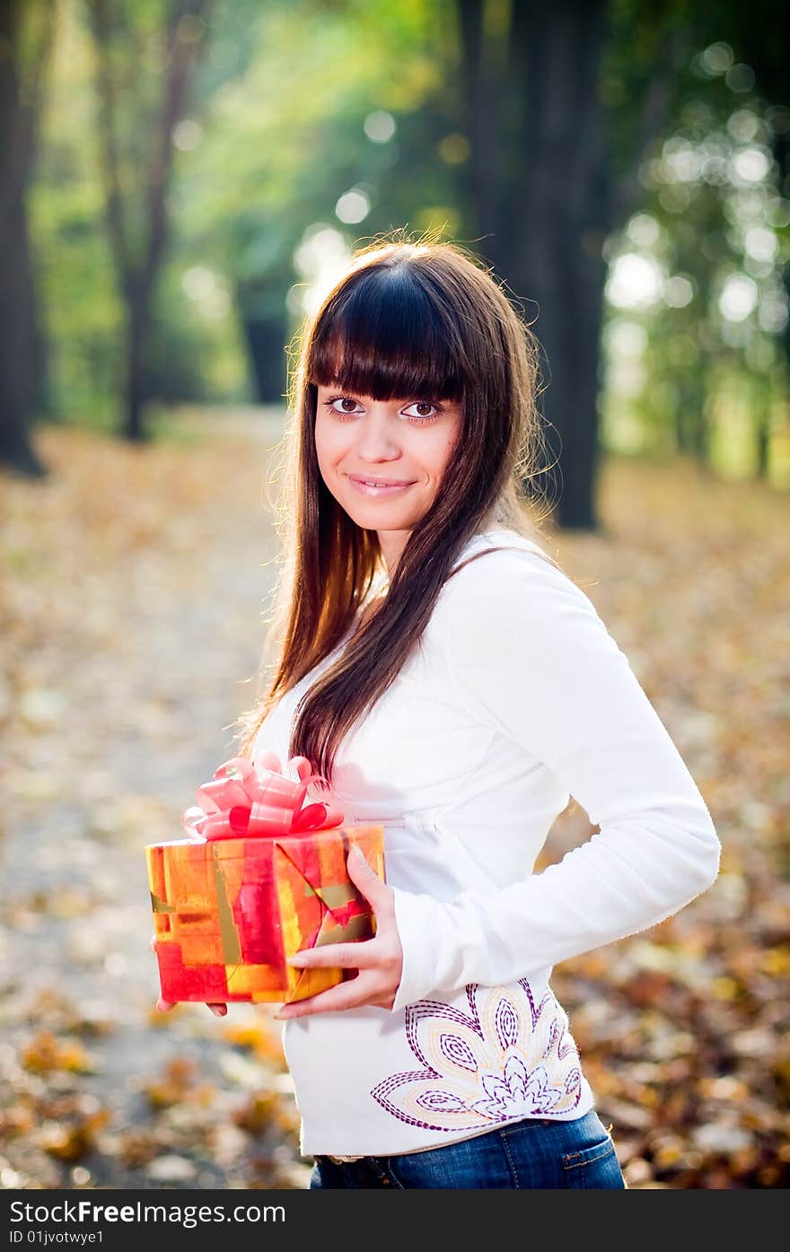 Young girl with gift boxes